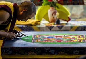 Tibetan Buddhist creating sand mandala