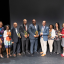 Winners of the 2019 Diversity Awards pose with their awards on stage during the ceremony.
